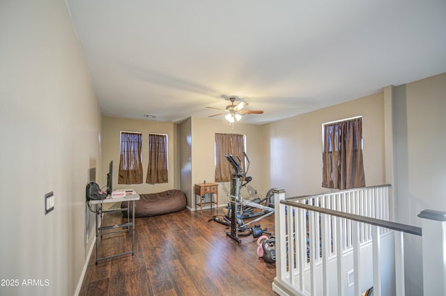 6811 W Darrel Rd, Laveen, AZ 85339 - exercise room featuring baseboards, a ceiling fan, visible vents, and wood finished floors