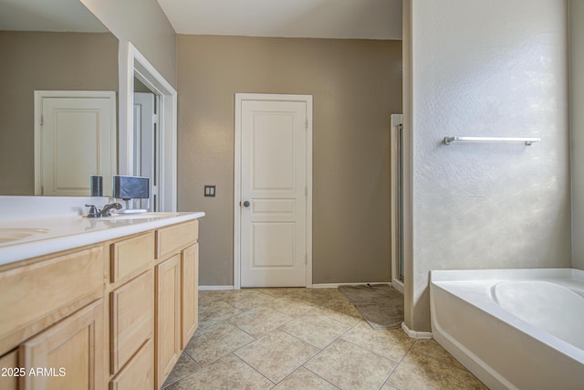 6811 W Darrel Rd, Laveen, AZ 85339 - bathroom with baseboards, a bath, a shower stall, tile patterned floors, and vanity