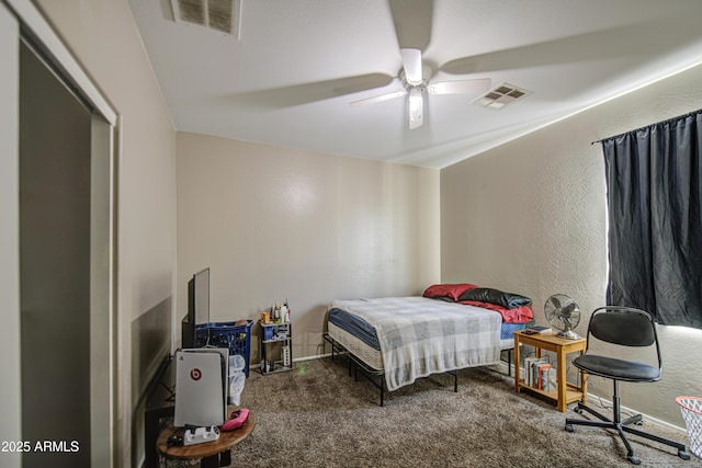 6811 W Darrel Rd, Laveen, AZ 85339 - carpeted bedroom with visible vents, baseboards, ceiling fan, and a textured wall