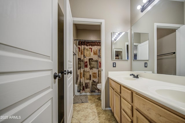 6811 W Darrel Rd, Laveen, AZ 85339 - full bath featuring double vanity, toilet, tile patterned flooring, and a sink