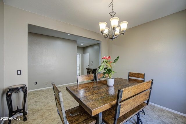 6811 W Darrel Rd, Laveen, AZ 85339 - dining area with a chandelier, baseboards, and light tile patterned flooring
