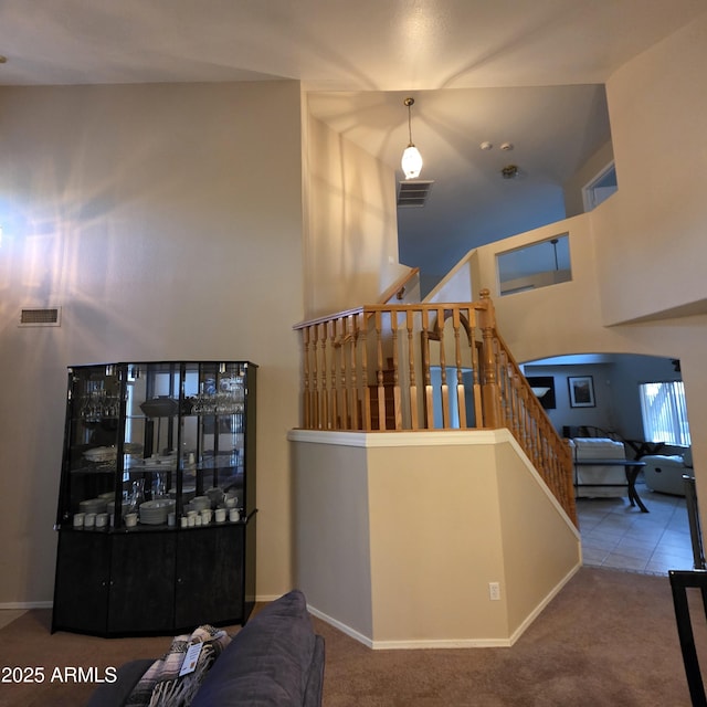 1032 E Sheffield Ave, Chandler, AZ 85225 - stairs featuring carpet, arched walkways, and a high ceiling