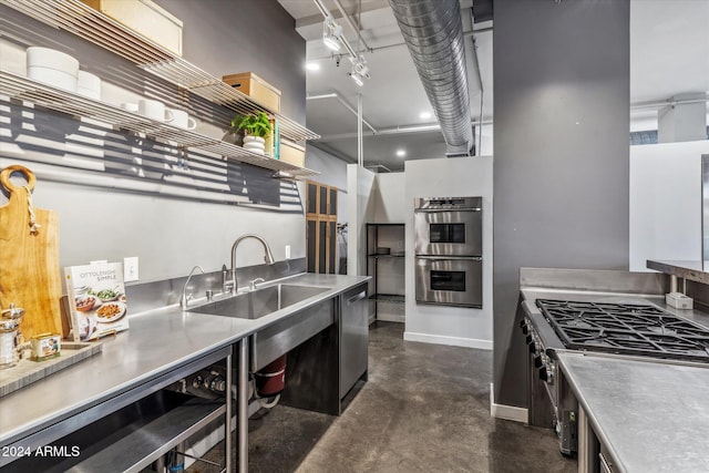 kitchen featuring stainless steel counters, stainless steel appliances, and sink