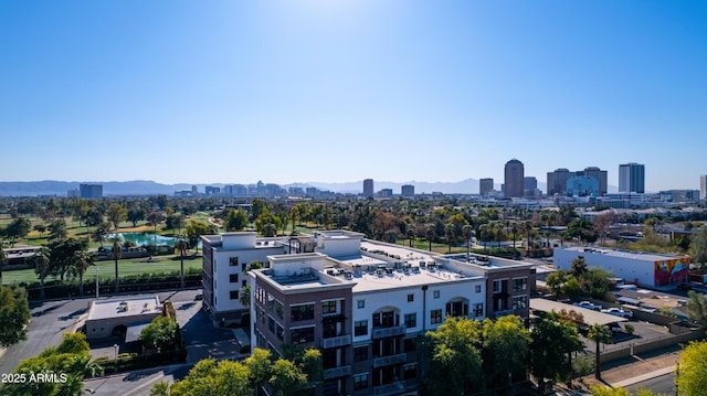 birds eye view of property with a mountain view