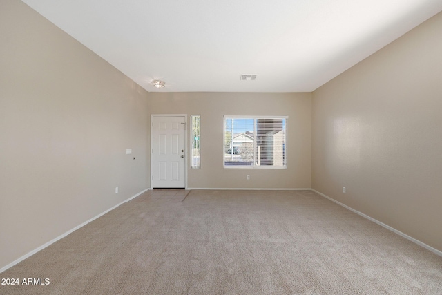 empty room featuring light colored carpet