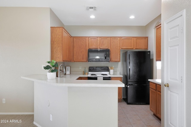 kitchen with black appliances, kitchen peninsula, sink, and light tile patterned floors