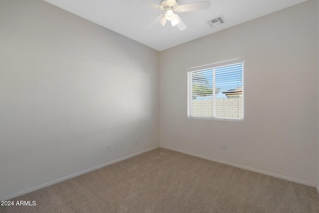 carpeted empty room with ceiling fan