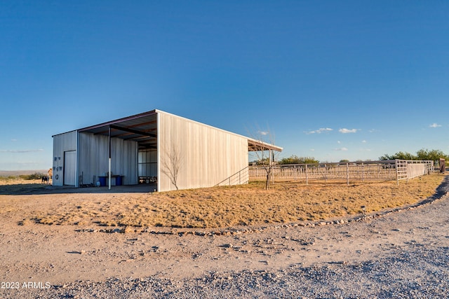 view of outdoor structure featuring a rural view