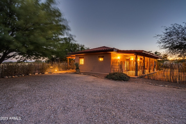 view of property exterior at dusk