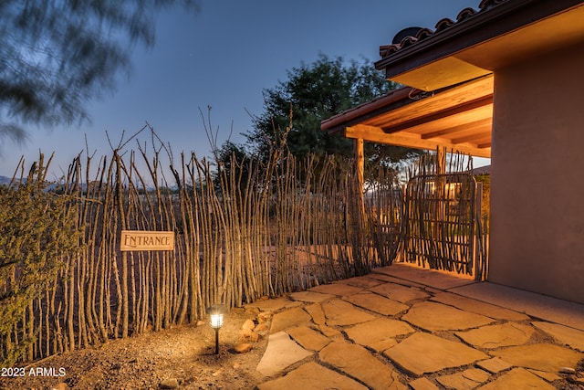 view of patio terrace at dusk