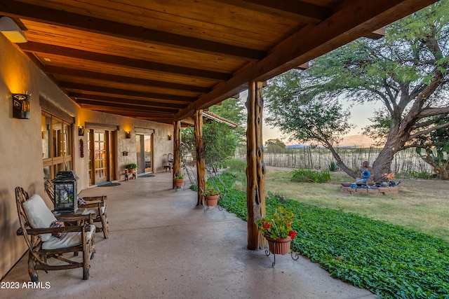 patio terrace at dusk with a yard