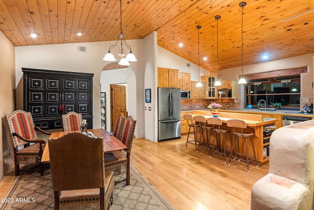 dining room with a notable chandelier, high vaulted ceiling, light hardwood / wood-style floors, and wooden ceiling