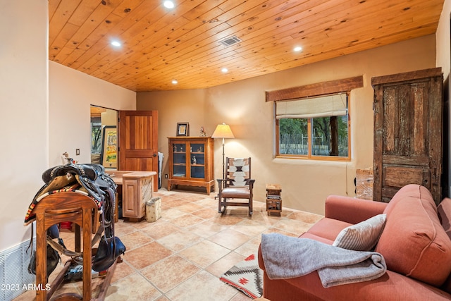 living room with wood ceiling and light tile floors