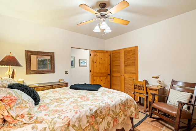 bedroom featuring light tile flooring and ceiling fan