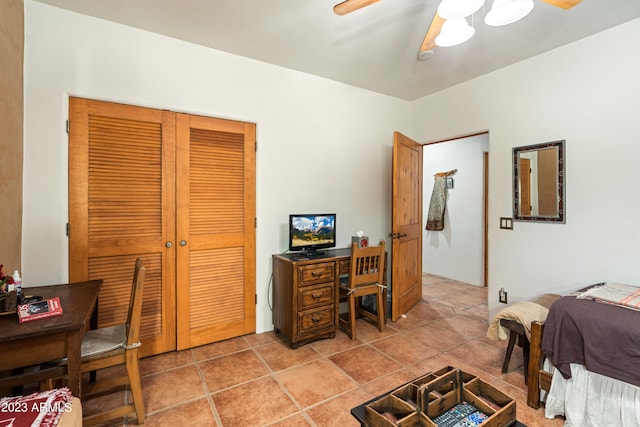 tiled office space with ceiling fan