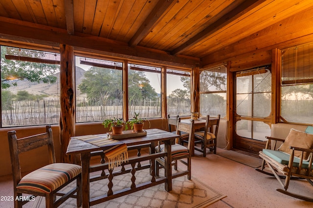 sunroom with wood ceiling and beam ceiling