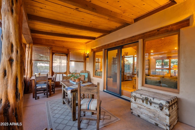 interior space featuring beam ceiling and wooden ceiling