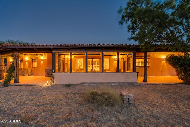 back of property featuring a patio area