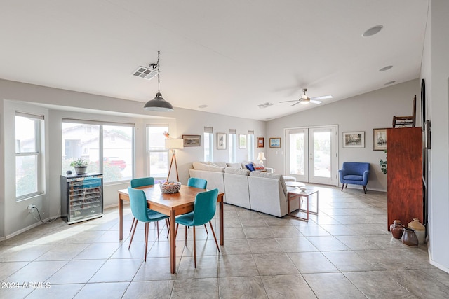 dining room with french doors, ceiling fan, light tile patterned floors, wine cooler, and lofted ceiling