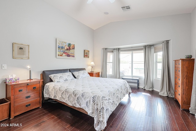 bedroom with ceiling fan, dark hardwood / wood-style flooring, and vaulted ceiling