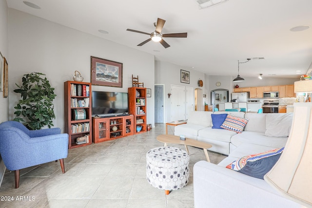 tiled living room featuring ceiling fan