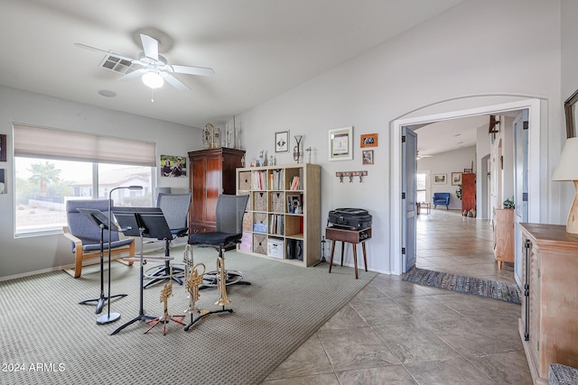 interior space featuring ceiling fan and vaulted ceiling