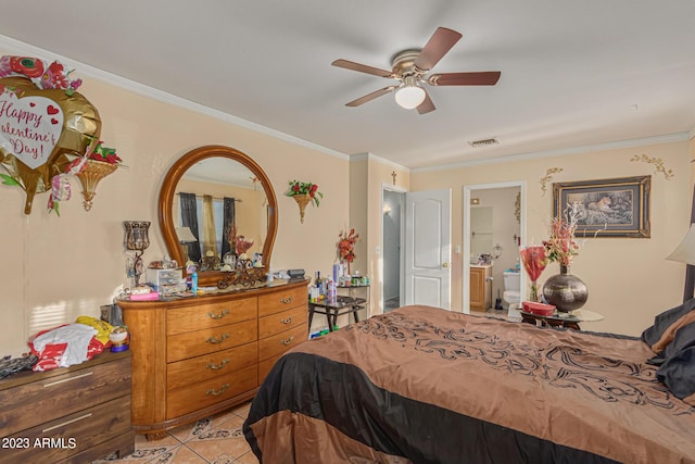 tiled bedroom with crown molding, ceiling fan, and ensuite bathroom