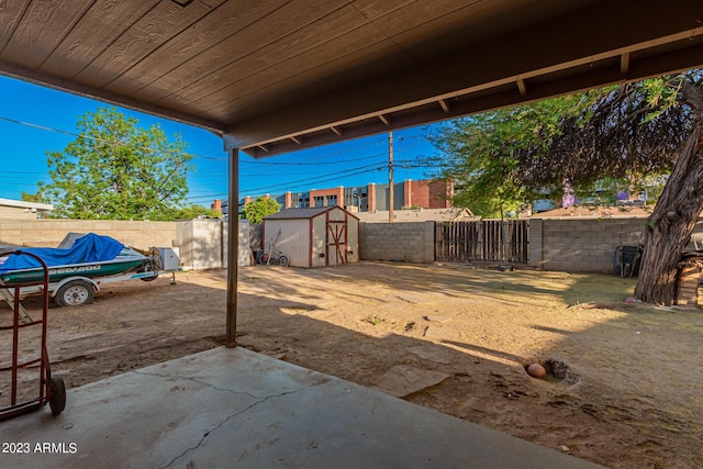 view of patio with a storage unit