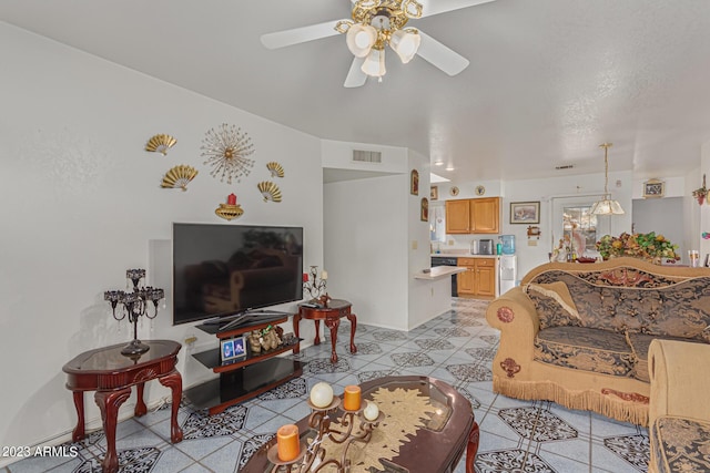 living room with ceiling fan and light tile patterned floors