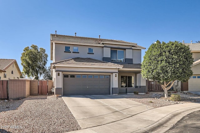 view of front of house with a garage, driveway, fence, and stucco siding