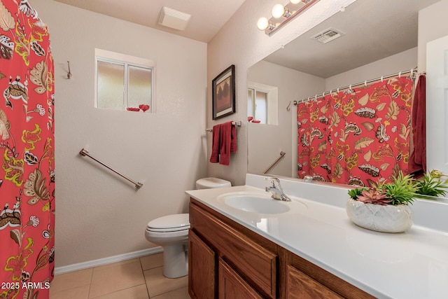 bathroom with tile patterned floors, vanity, and toilet