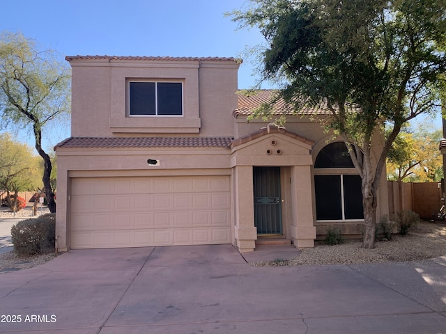 mediterranean / spanish-style home with a garage