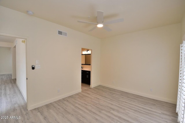 unfurnished bedroom featuring ceiling fan, connected bathroom, and light hardwood / wood-style floors