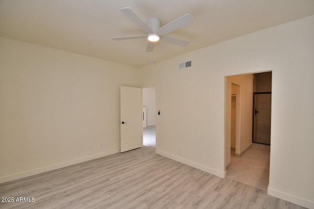 unfurnished room featuring ceiling fan and light wood-type flooring