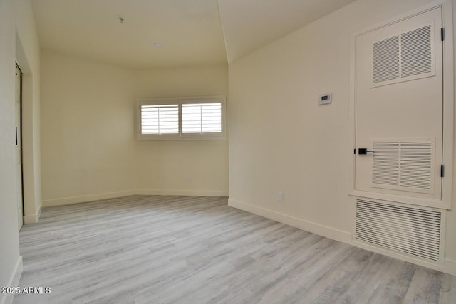 unfurnished room with light hardwood / wood-style floors