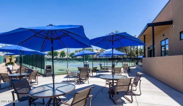 view of patio featuring tennis court