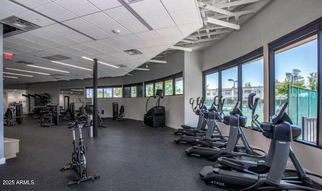 exercise room featuring a paneled ceiling