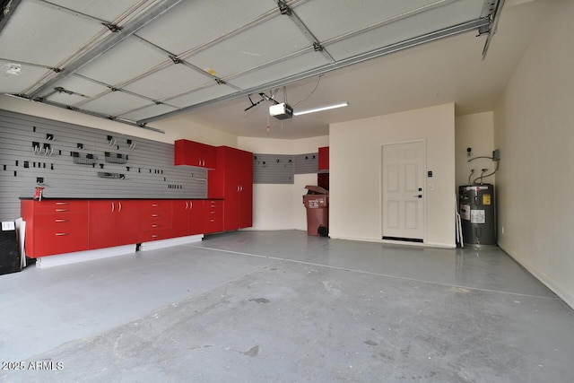 garage with water heater and a garage door opener