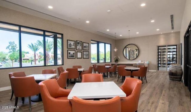 dining space with light hardwood / wood-style flooring