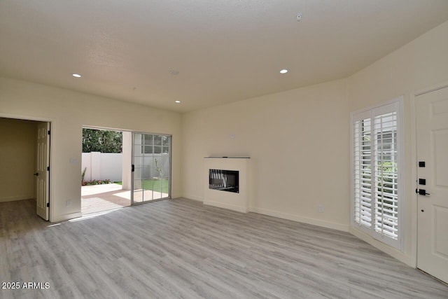 unfurnished living room with light hardwood / wood-style floors