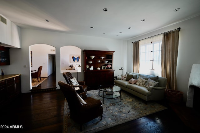 living room with dark hardwood / wood-style flooring