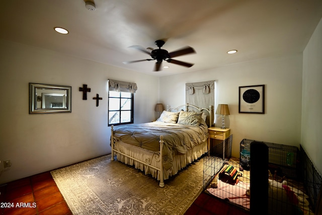 bedroom with ceiling fan and tile patterned floors