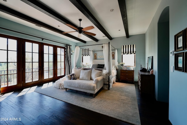 bedroom featuring ceiling fan, beam ceiling, and dark wood-type flooring