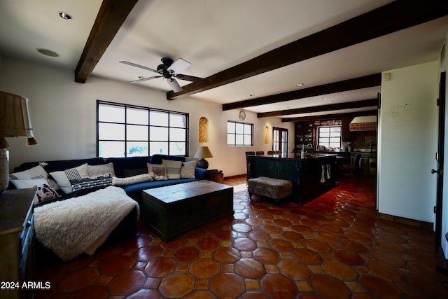 living room with ceiling fan and beam ceiling