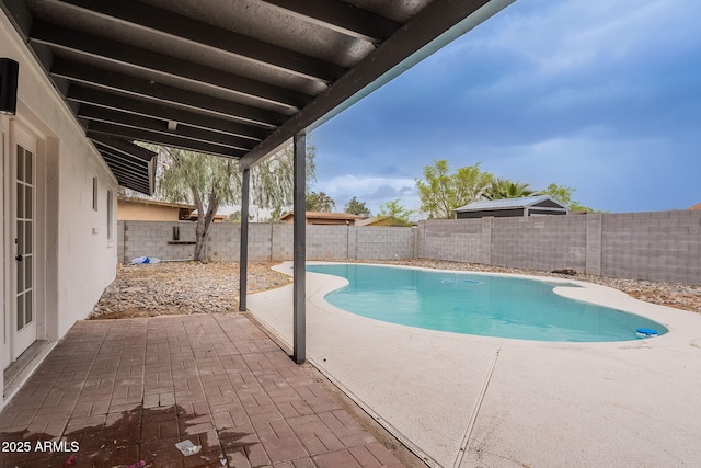 view of pool with a fenced in pool, a patio, and a fenced backyard