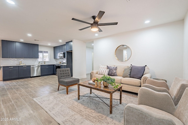 living area featuring light wood finished floors, visible vents, recessed lighting, and a ceiling fan