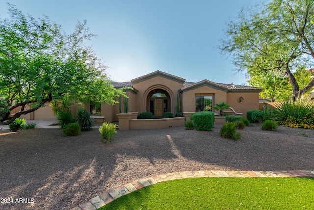 mediterranean / spanish-style house featuring french doors and a garage