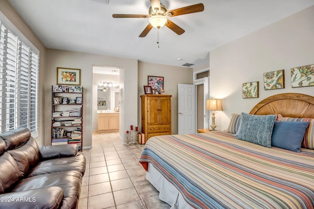 tiled bedroom featuring ceiling fan and connected bathroom