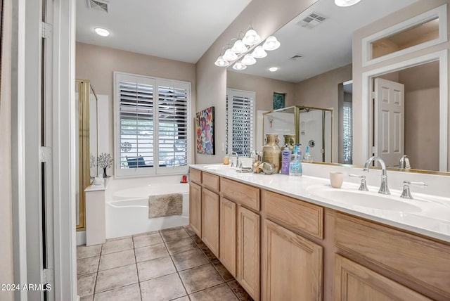 bathroom featuring tile patterned floors, vanity, and independent shower and bath