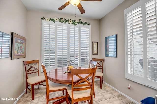 dining area featuring light tile patterned flooring, plenty of natural light, and ceiling fan